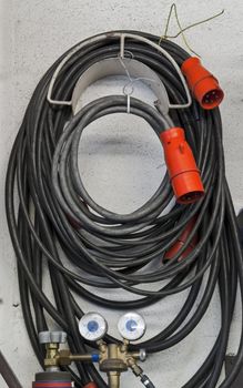 high current cables in repair shop with red plugs