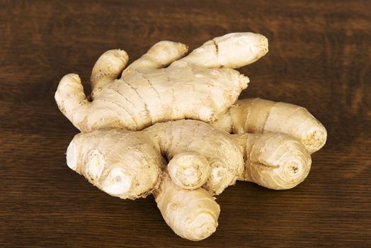 Ginger on kitchen wooden table.