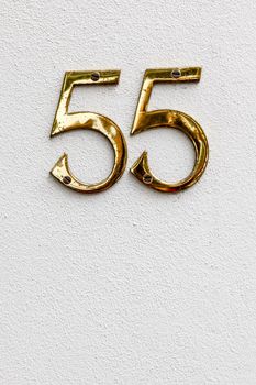 An image of the number 55 on the wall