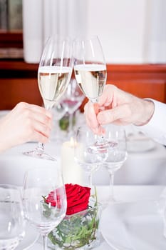 happy smiling couple in restaurant celebrate toast champagne dinner