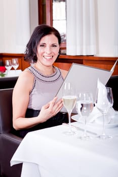 man and woman in restaurant waiter bring card and order food