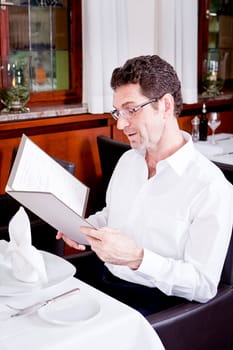 man and woman in restaurant waiter bring card and order food