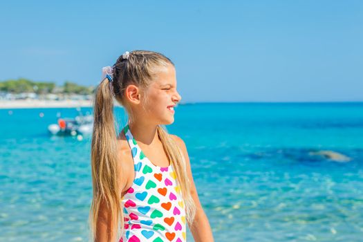 Portrait of cute happy girl on the beach