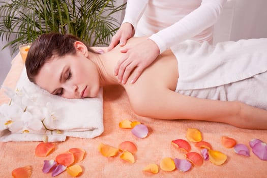 young attractive smilig woman doing wellness spa relaxing massage