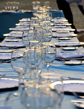 Exterior place setting for ocean side wedding celebration