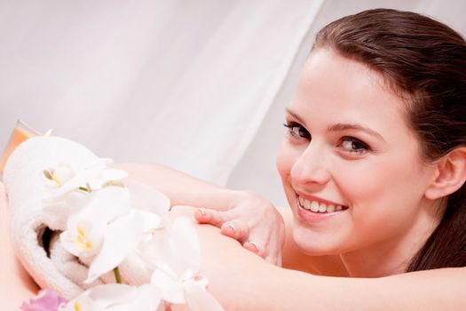 young attractive smilig woman doing wellness spa relaxing massage