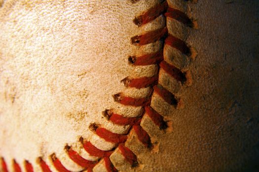 A closeup of an old weathered baseball
