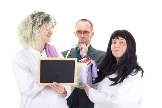 Female cleaners in white work coats with supervisor