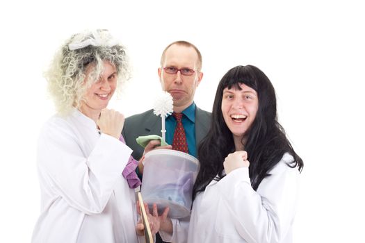 Female cleaners in white work coats with supervisor