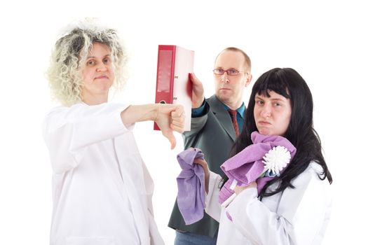 Female cleaners in white work coats with supervisor