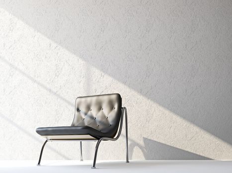 A black leather chair near the wall