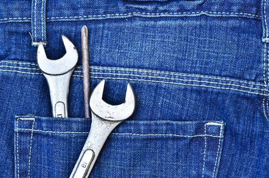 tools in new blue jeans