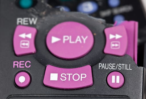 Broken remote control with focus on stop button