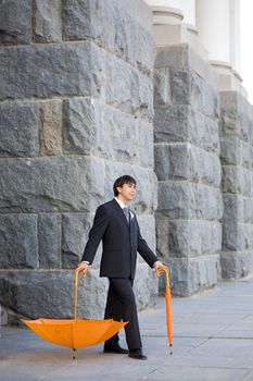 handsome groom with umbrella