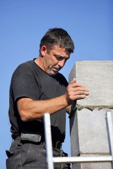 Construction worker building a wall