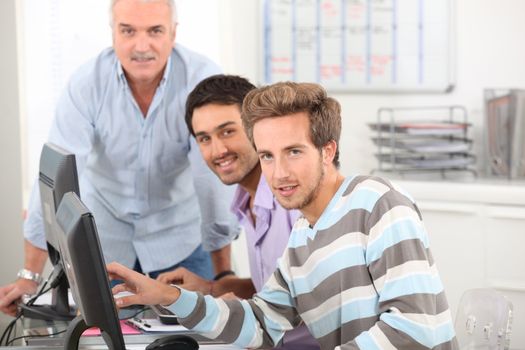 Young men working at their computers