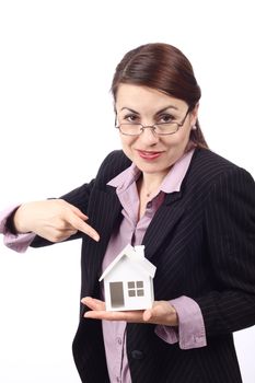 Young woman holding house model. Real estate concept