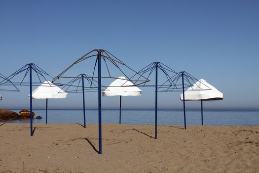 Picture of beach umbrellas at sunset