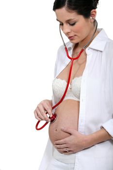 Pregnant woman with a stethoscope