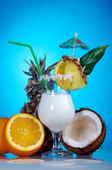 Pina Colada - Cocktail with Cream, Pineapple Juice and Rum on blue background