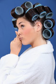 Woman with her hair in rollers