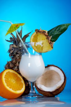 Pina Colada - Cocktail with Cream, Pineapple Juice and Rum on blue background