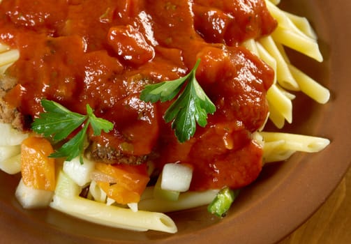  pasta with tomato beef sauce  on wooden table