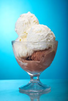 ice cream and vanilla  closeup .on blue background.