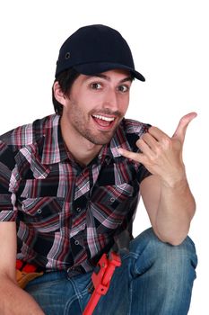 A male construction worker making a hand sign.