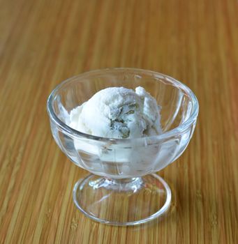 coconut ice cream  in bowl with green jelly