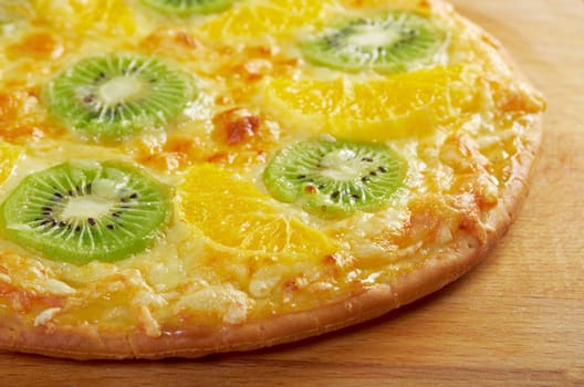 homemade sweet pizza with fruit.with orang kiwi,sauce