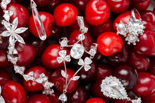 Jewels at fruit red ripe cherries berry background