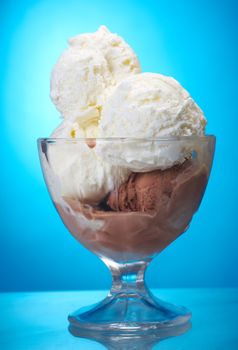 ice cream and vanilla  closeup .on blue background.