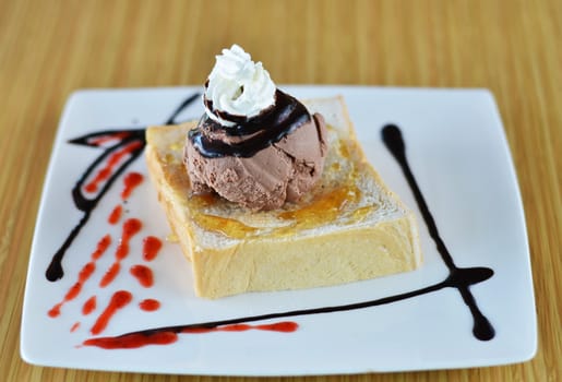 Honey toast  and whipping cream with chocolate ice cream