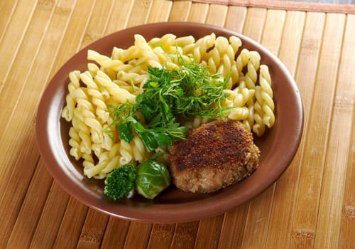 delicious macaroni pasta  with beef cutlets,vegetableon