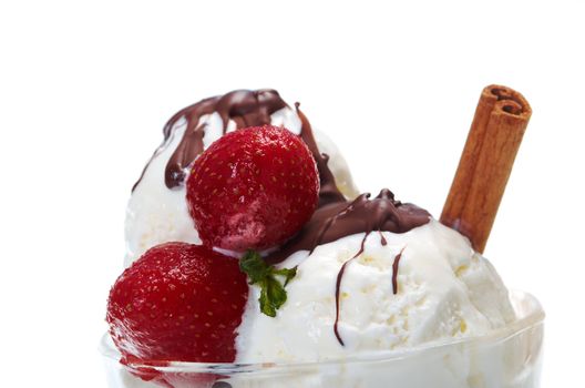 ice cream  with chocolate sauce and strawberries,cinnamon. closeup.isolated on white background.

