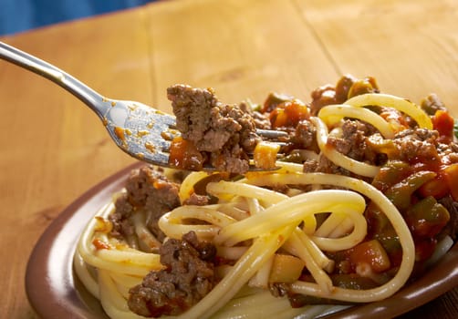  pasta with  beef ,vegetable  tomato sauce  on wooden table