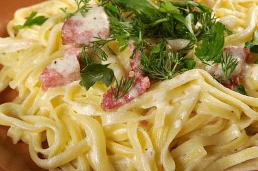 pasta Fettuccine Alfredo with sausage. close-up