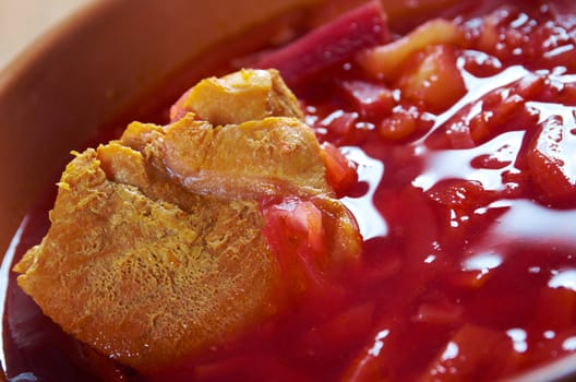 ukrainian and russian red-beet soup (borscht) with garlic and sour cream