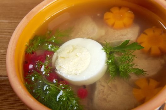 Aspic from meat decorated with egg, carrot,