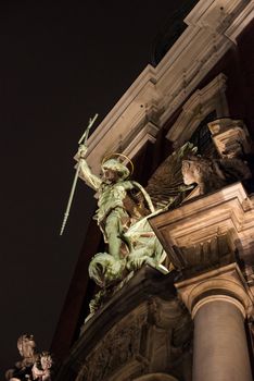 Beautiful statues on the entrance of St. Michaelis, commonly known as Michel, main church of Hamburg, Germany at dusk