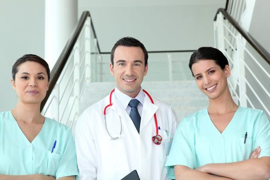 Portrait of two female nurses with doctor