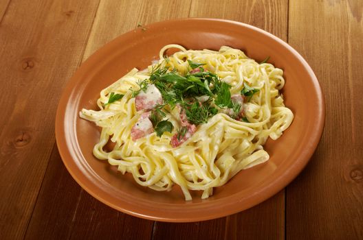 pasta Fettuccine Alfredo with sausage. close-up