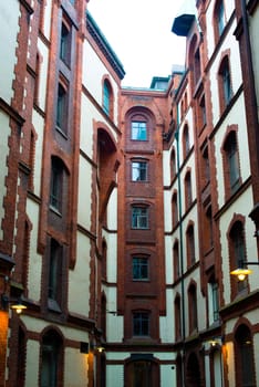 Famous old Speicherstadt in Hamburg, Germany - buildings with white plaster and red bricks