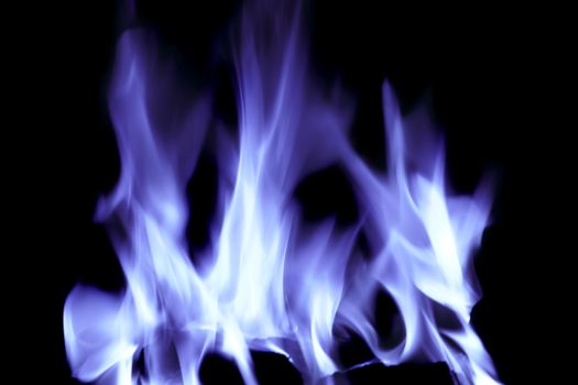 bright blue flames on an open fire that give that warm feeling