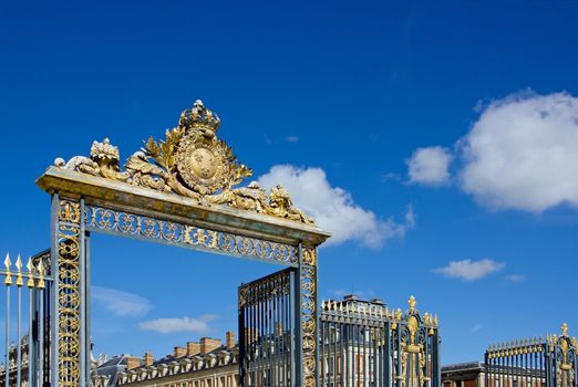 majestic entrance to the castle of Versailles (France)