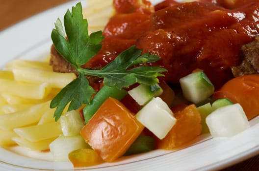  pasta with tomato beef sauce  on wooden table