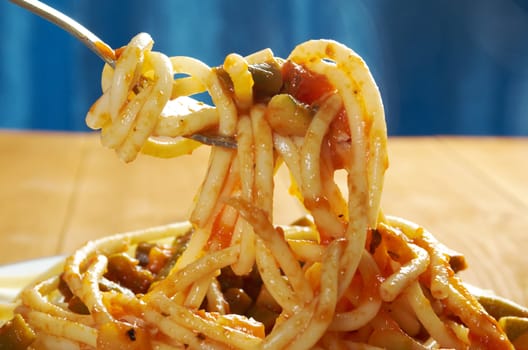  pasta with tomato  sauce  on wooden table