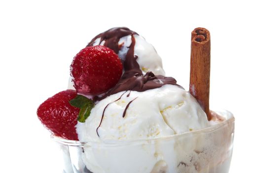 ice cream  with chocolate sauce and strawberries,cinnamon. closeup.isolated on white background.
