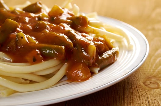  pasta with tomato  sauce  on wooden table